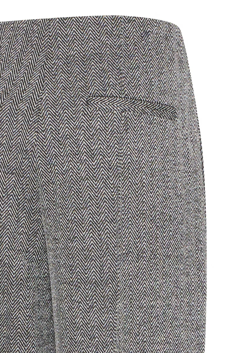 Tailleur spigato con giacca oversize e pantalone palazzo