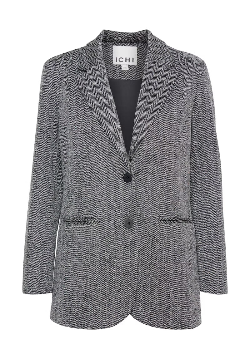 Tailleur spigato con giacca oversize e pantalone palazzo