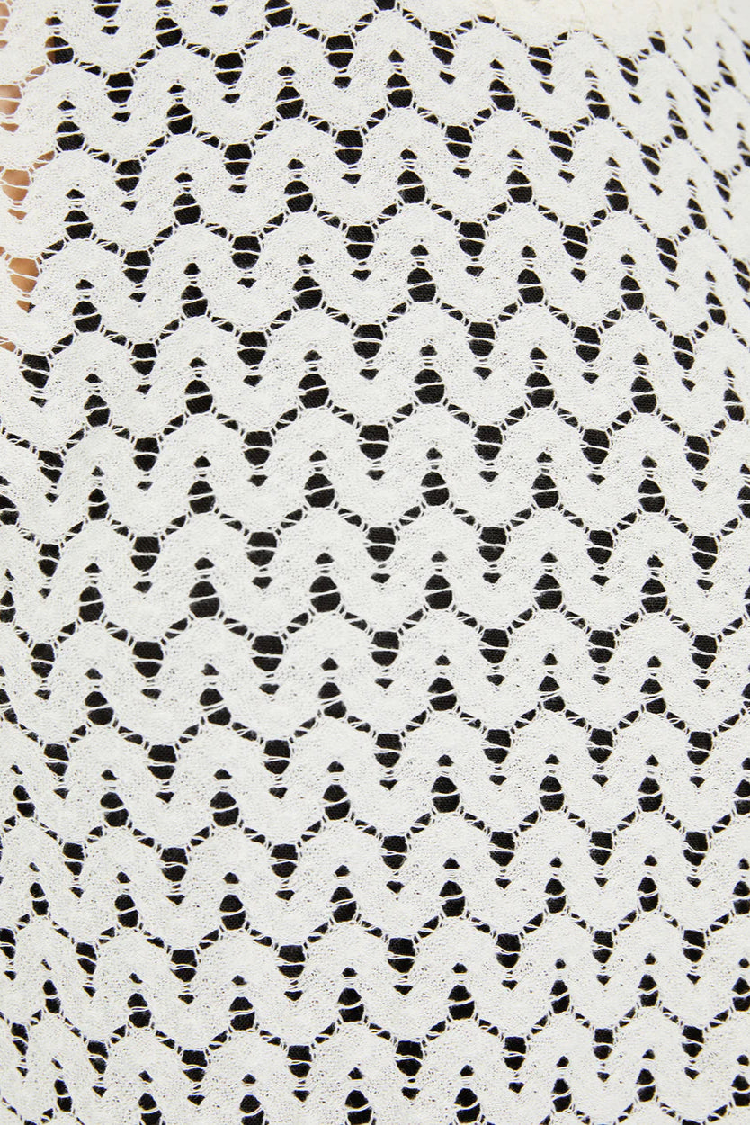 Maglia in macramè a maniche corte