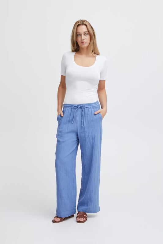 Pantalone celeste in cotone con elastico e coulisse in vita