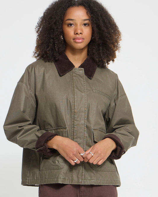 Short green jacket with contrasting dark brown collar