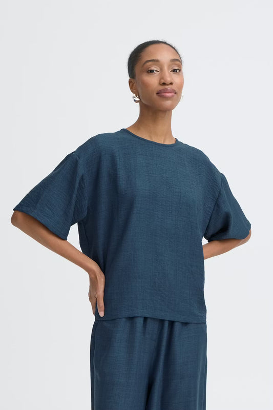 Maglia blu in cotone con chiusura dietro