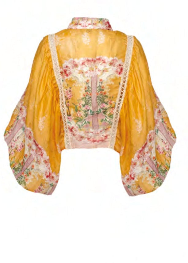 Camicia arancio a fantasia floreale con ricami