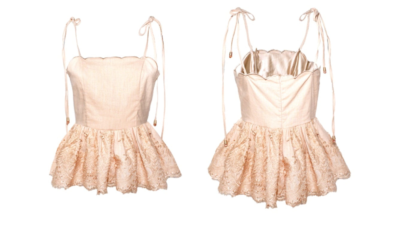 Completo rosa con ricami in pizzo sull'orlo con top smanicato e pantalone a vita alta