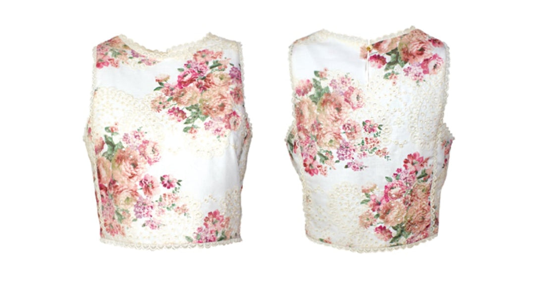 Completo bianco floreale e ricami in macramè con top smanicato e pantalone palazzo