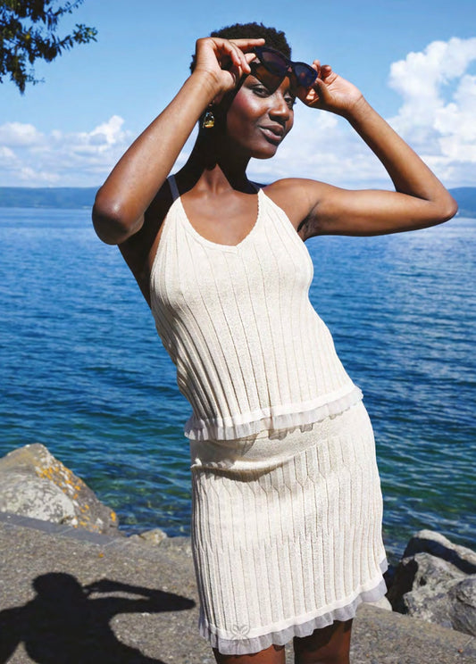 Completo in maglina lurex oro con top e gonna corta
