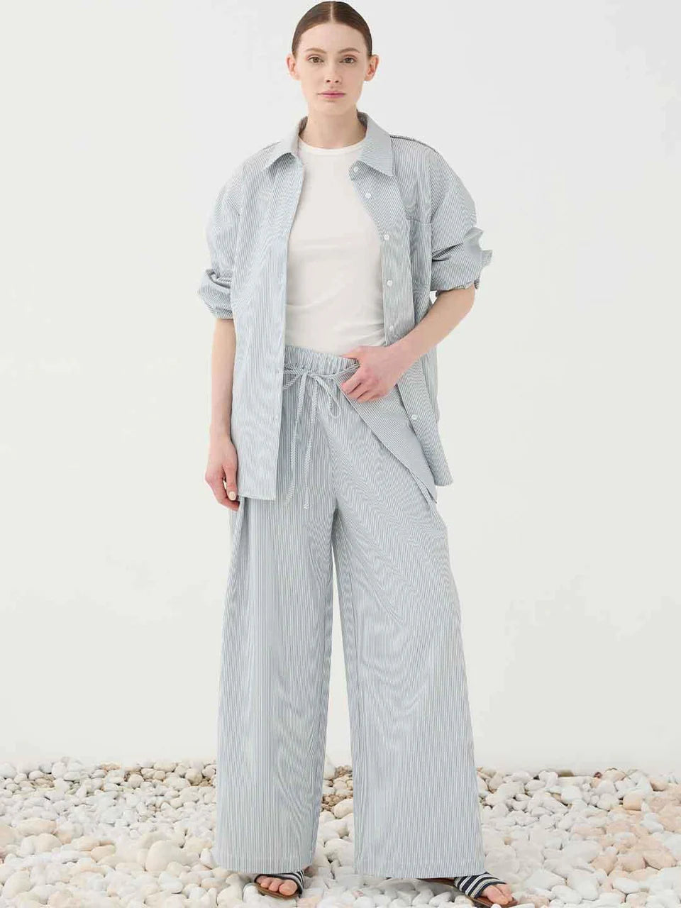 Pantalone palazzo celeste a righe con pareo rimovibile