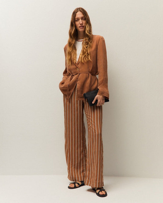 Pantaloni a righe a gamba larga con tasche laterali e chiusura con zip e bottone