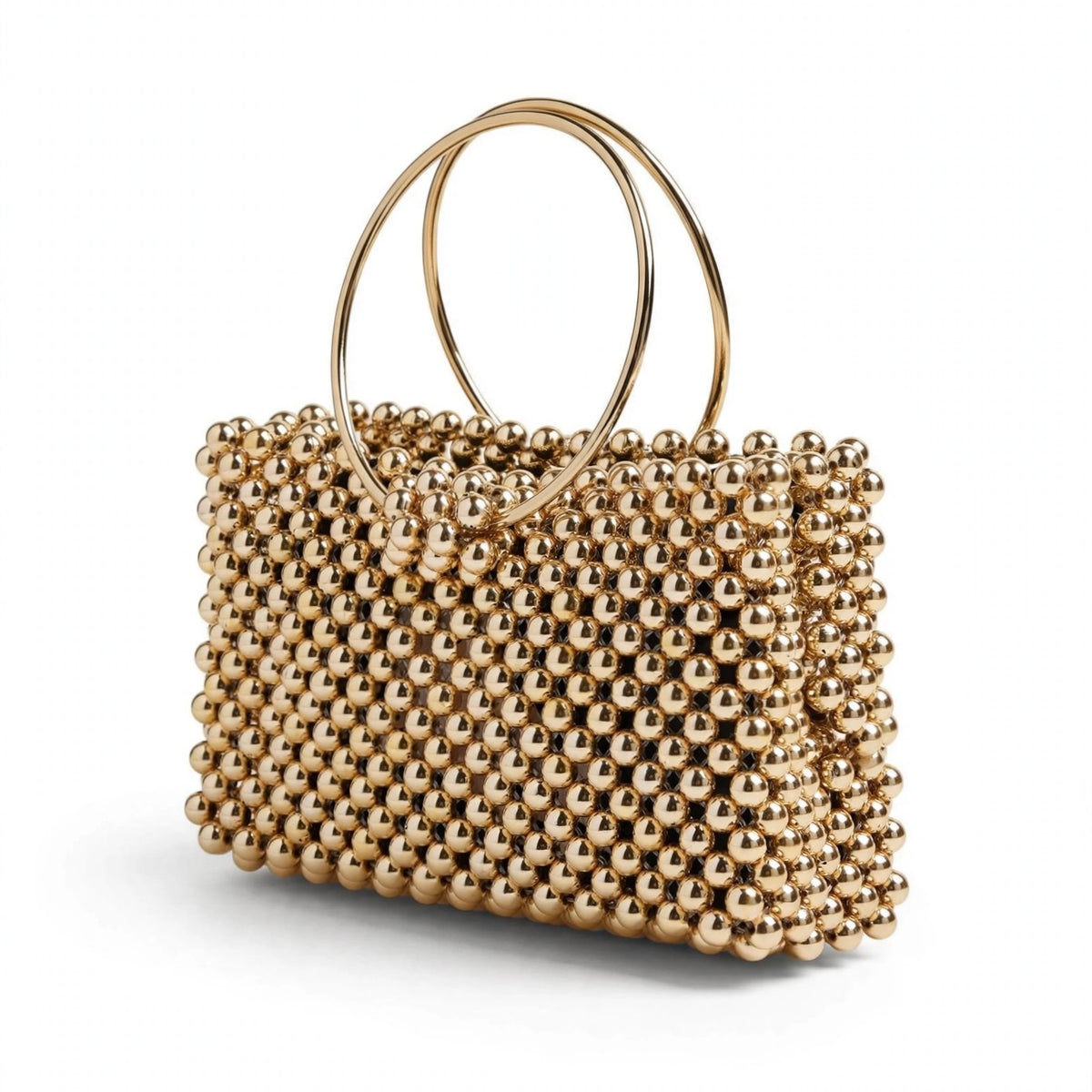 Gold handbag with rigid handle