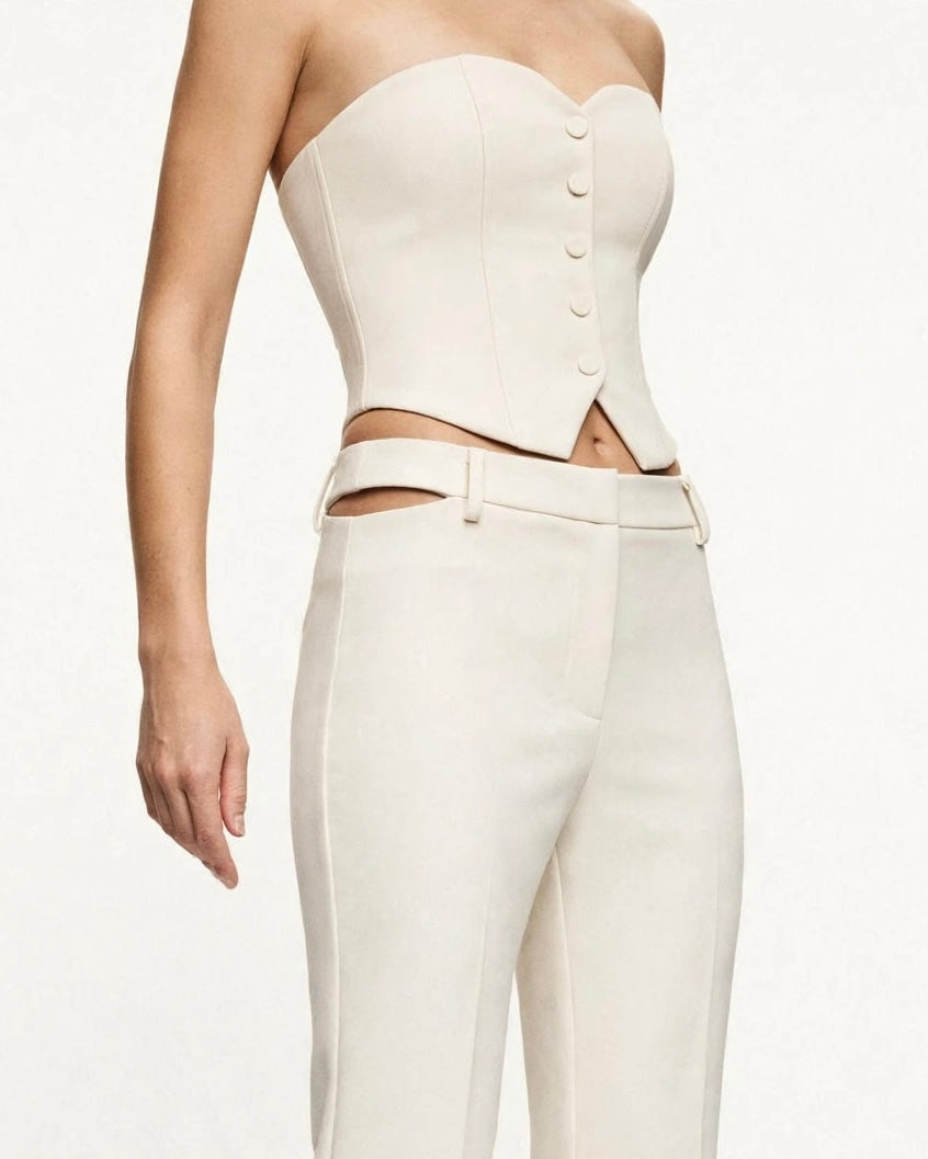 Completo marmo top decolté con bottoni e pantalone a zampa con aperture laterali in vita