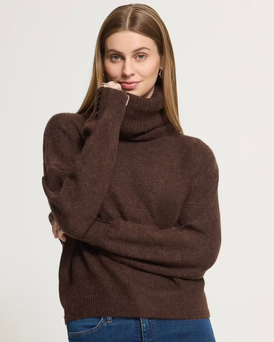 Oversized dark brown turtleneck sweater with buttons on the cuffs