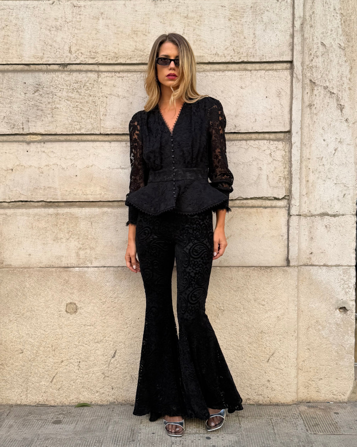 Black flared trousers with lace and velvet details