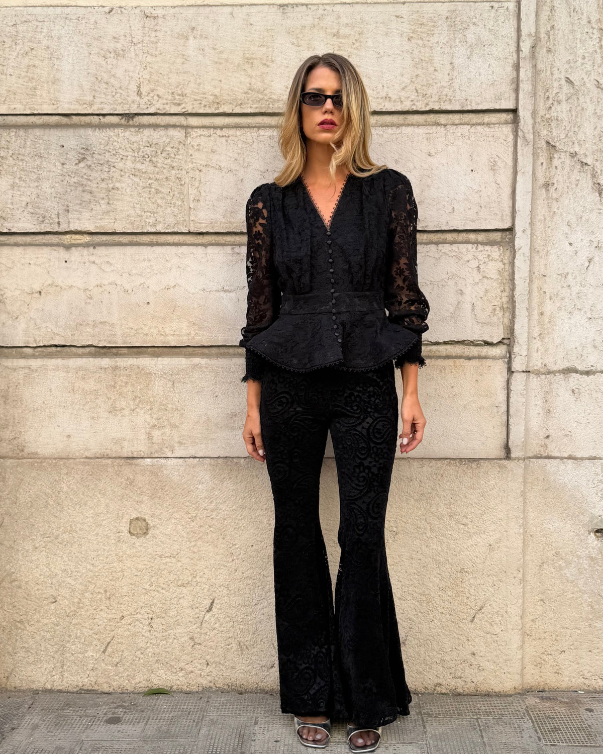 Black flared trousers with lace and velvet details